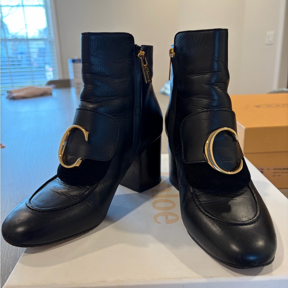 Chole Black Leather Ankle Boots with Gold C Buckle